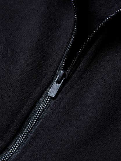 The RIGEL hoodie from PALKAN, a custom designed full-zip hoodie with wrist and shoulder pleats, zoomed in on the black metal zip